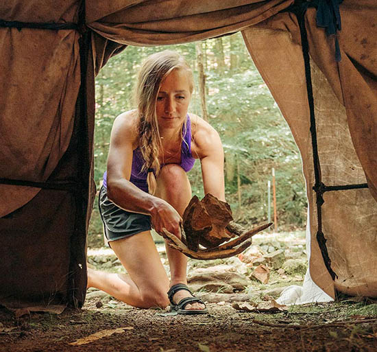 woman entering tent