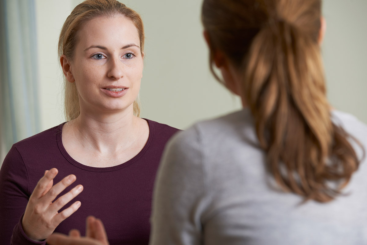 women talking with each other learning what is dual diagnosis treatment