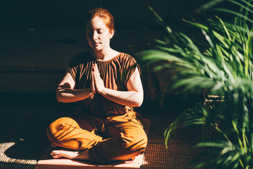 woman doing yoga experiencing the benefits of yoga for recovery