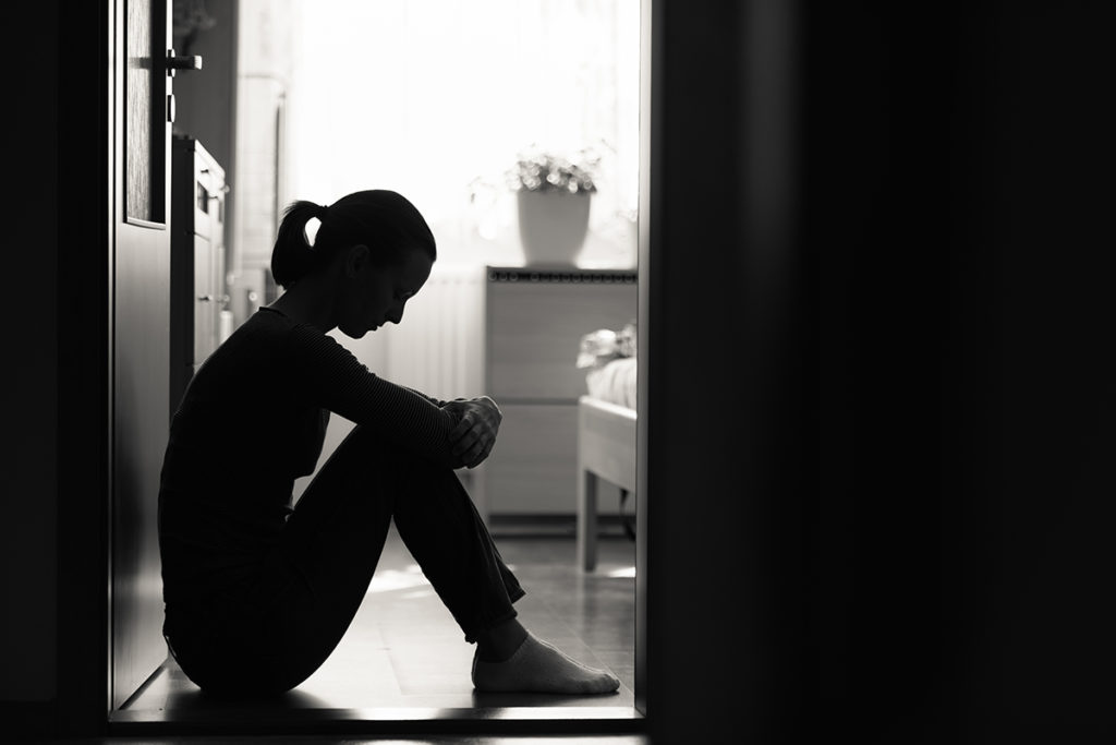 silhouette of woman dealing with childhood trauma and addiction