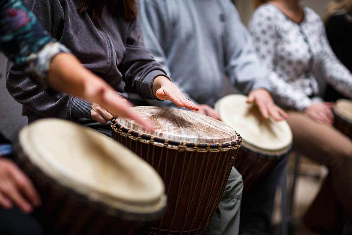 group playing drums during a music therapy program session