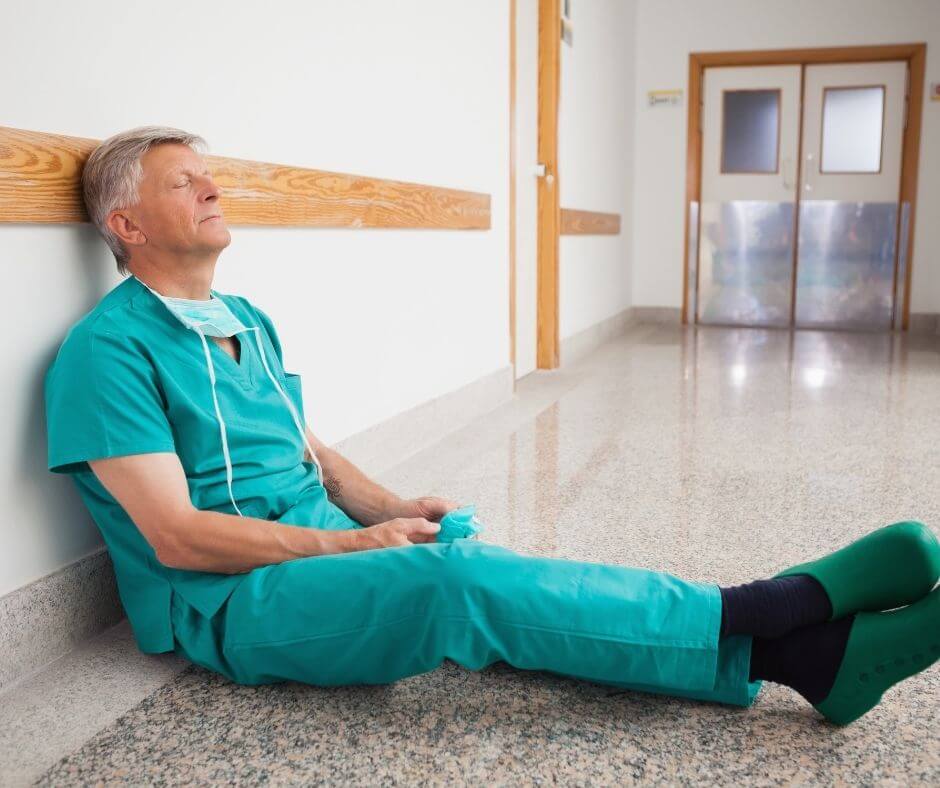 A medical professional using meditation for healing during a break