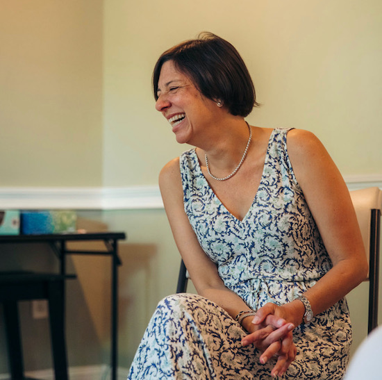 woman smiling during a therapy session