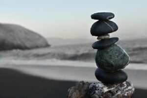 stacking stones, or cairns, represent groundedness and calm. meditation techniques for anxiety also contribute.