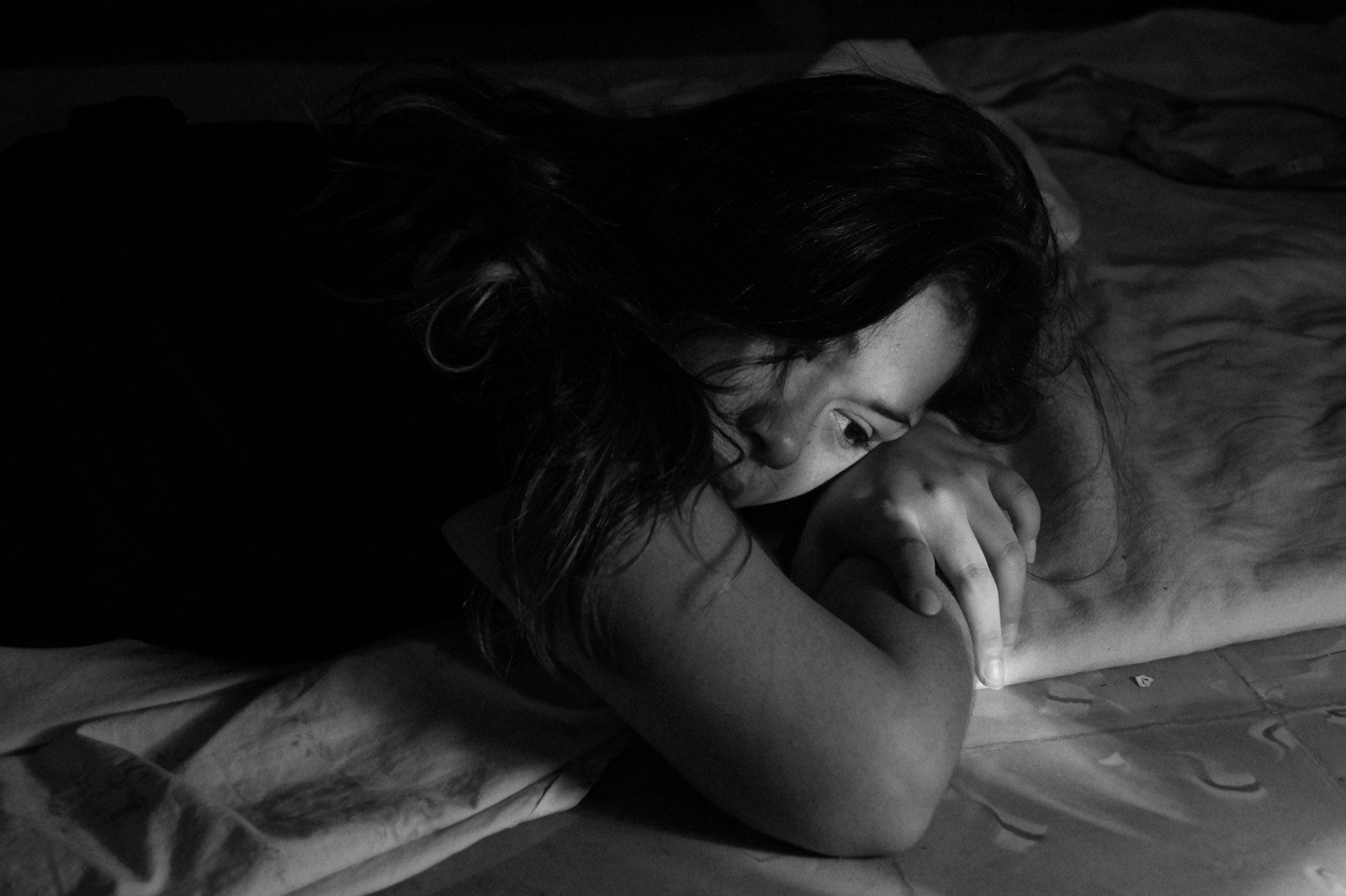 woman leaning on bed, codependency and addiction