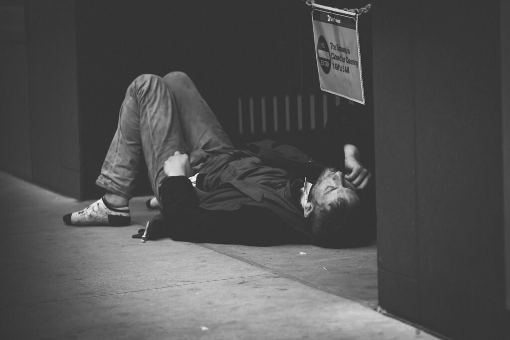man lying on floor addicted to heroin