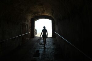 silhouette of person walking on tunnel, How Long do Detox Symptoms Last