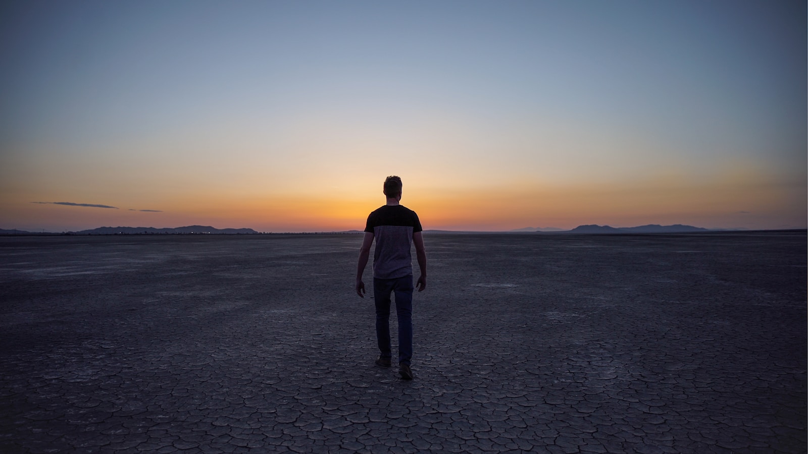 love avoidant man walking on desert