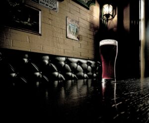 a glass of beer on a table