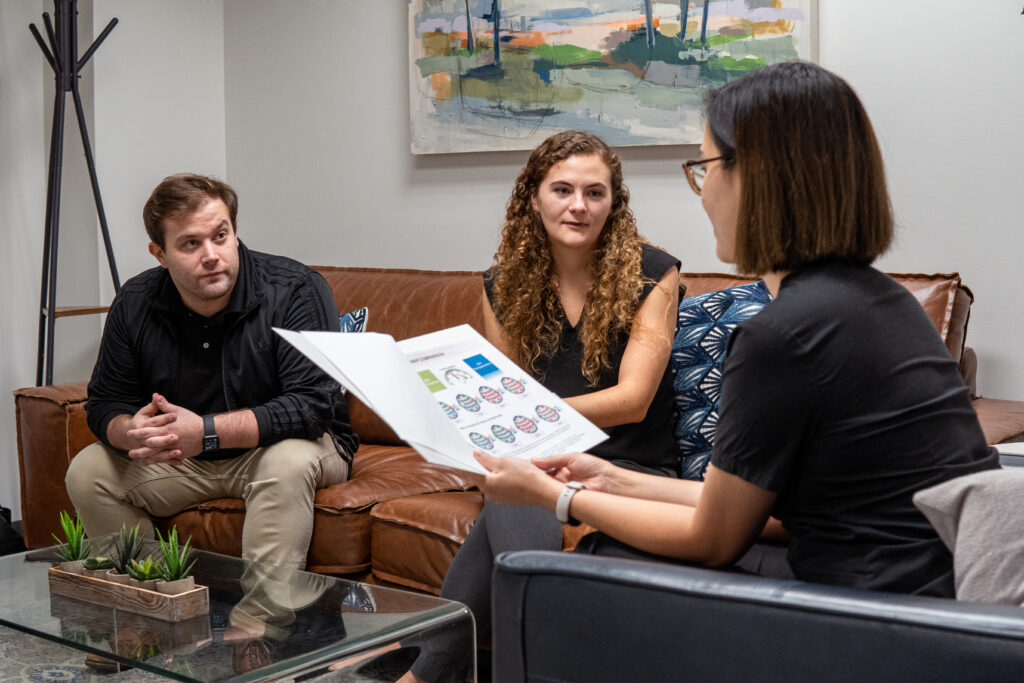 Couple discussing neurofeedback therapy with nurse