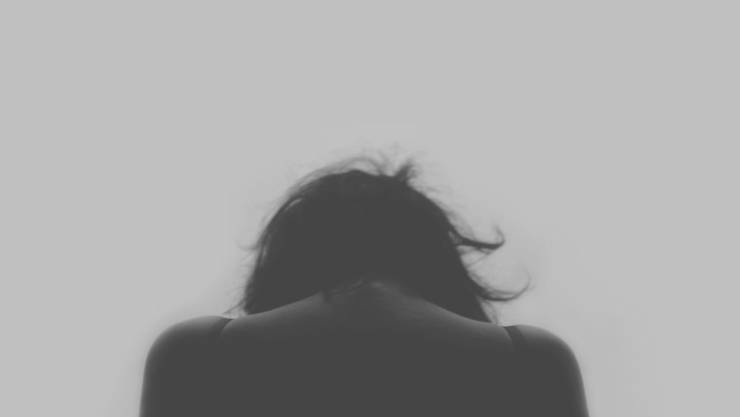 woman looking down sad