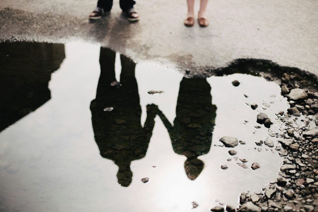 man and woman holding hand together navigating how childhood trauma affects relationships