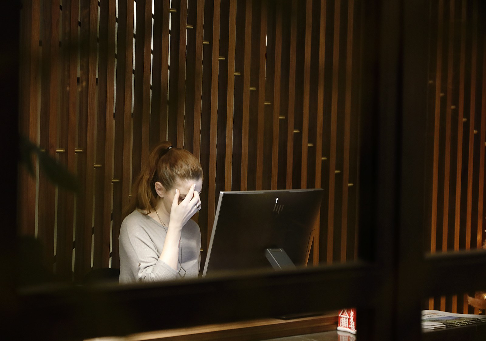 a woman sitting in front of a laptop computer, asking does porn cause anxiety