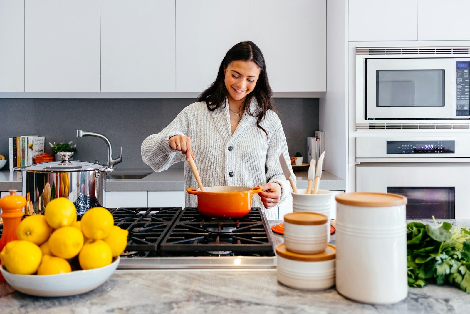woman practicing self-care in recovery and cooking inside kitchen