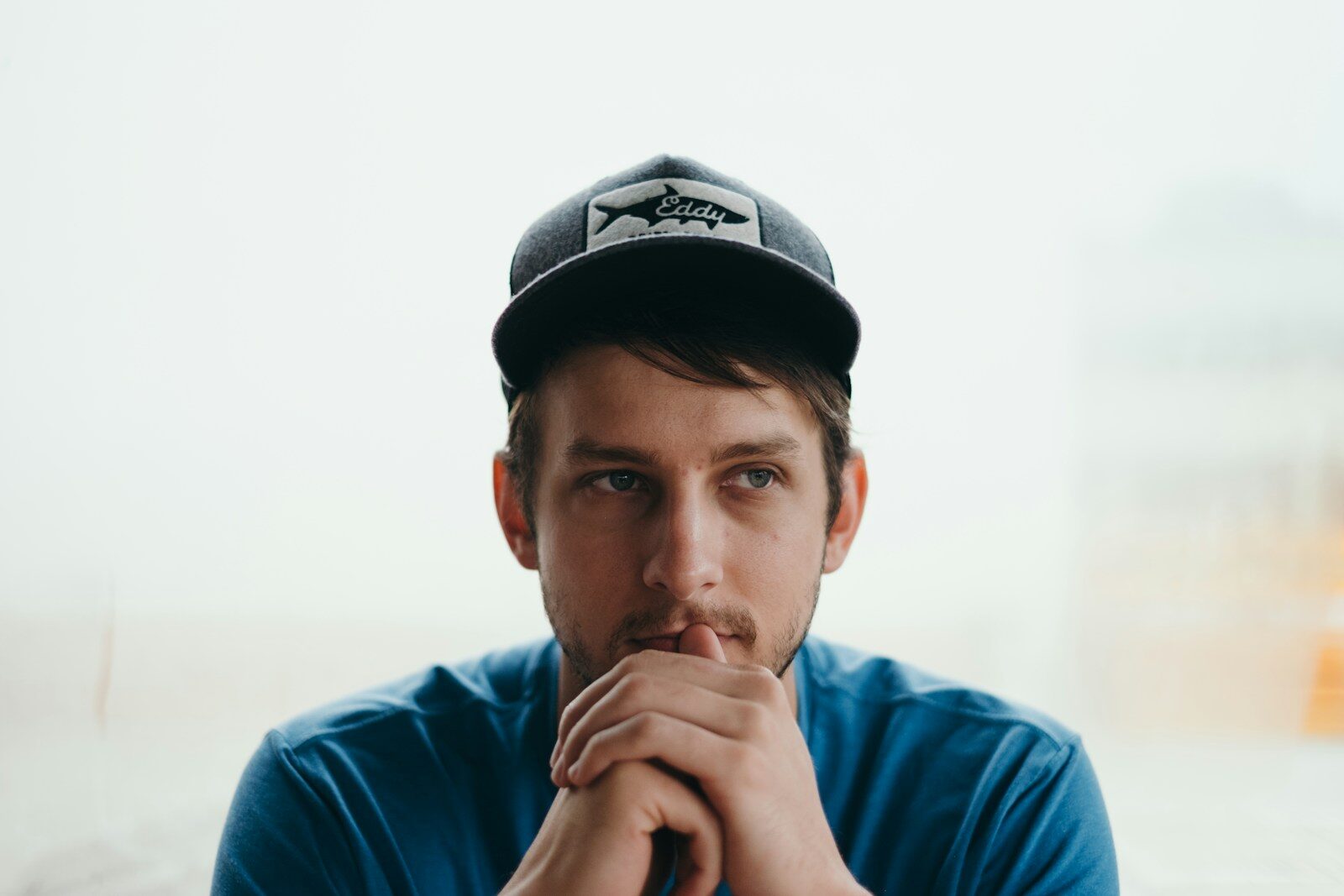 men wearing black cap thinking about porn addiction side effects