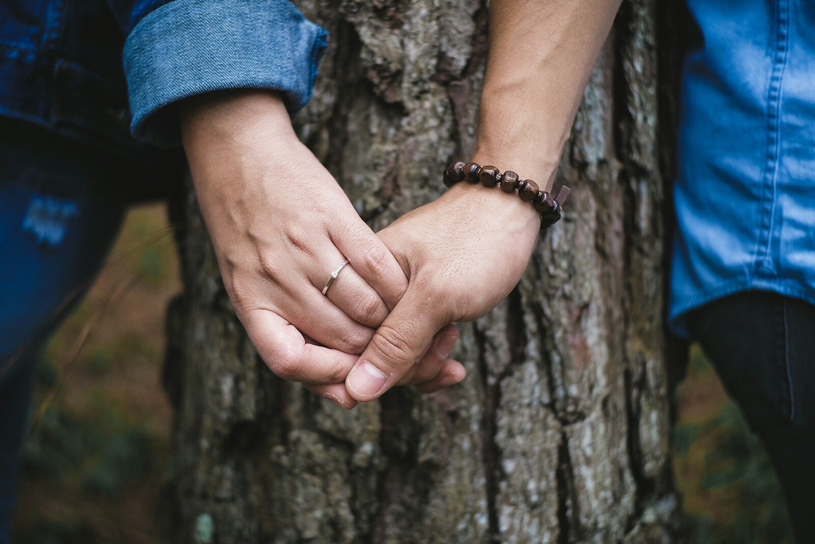 Wife addicted to porn holding hands with her spouse